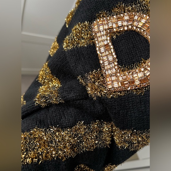 DOLCE&GABBANA
Cashmere blends
Black and gold sweater - Picture 7 of 13